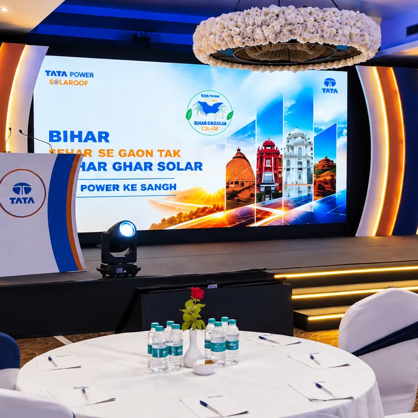 Tata Power Solaroof Bihar campaign launch stage with a curved branded set, LED screen and banquet seating by RAW Group